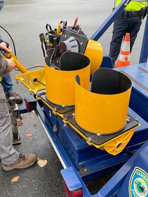 A close-up shot of a traffic signal being prepped to go in on Garden Street